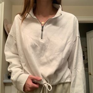 Cropped half zip sweatshirt.